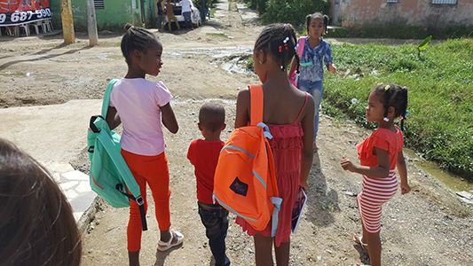 children with backpacks