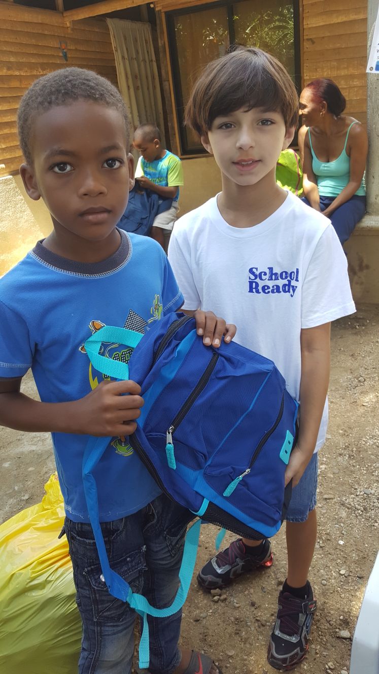 backpack held by kids